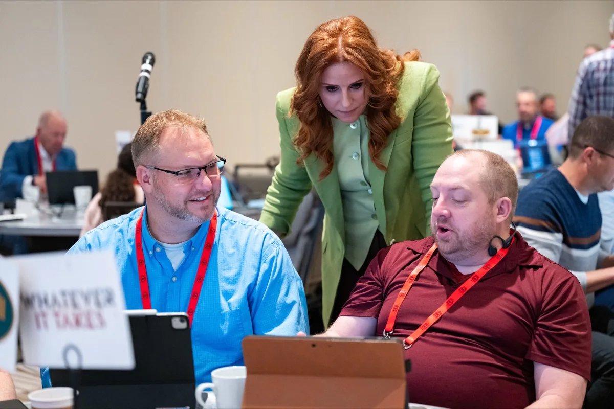 Robin Robins reviewing a campaign with MSP owners